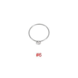 Close-up of polished silver stainless steel ring with a round bezel setting for DIY gems