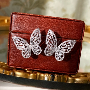 Exquisite silver needle butterfly stud earrings with sparkling cubic zirconia on a leather box