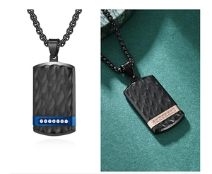 Detail view of square pendants with bark texture, blue and rose gold accents and diamonds