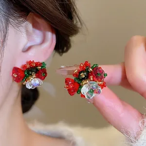 Floral beaded crystal earrings with red and green flower cluster design in silver needle