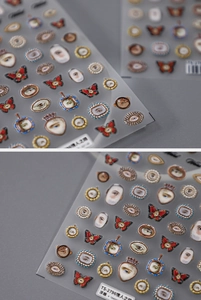 Detail of embossed Lover's Eye nail art decals with vintage Victorian era motifs