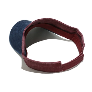 Detail view of washed vintage sun visor featuring color-block design and adjustable strap