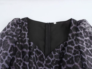 Detail of leopard print organza dress with back zipper and size S neck label