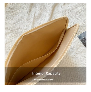 Macro view showing the internal capacity and padded fabric compartment of the laptop sleeve