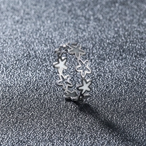 Detailed close-up of 304 stainless steel glowing ring featuring star shaped patterns