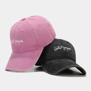 Washed cotton baseball caps in pink and black featuring Hello Gorgeous embroidery