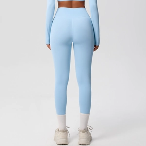 High-waisted light blue yoga pants and long-sleeve crop top athletic set for women