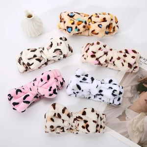 Selection of six soft plush leopard print headbands in various colors for skincare and makeup