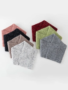 Collection of thick knitted neck warmers in various colors including pink, grey and beige