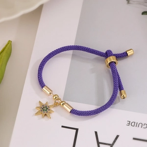 Adjustable purple cord bracelet with gold octagon star pendant and colorful zircons