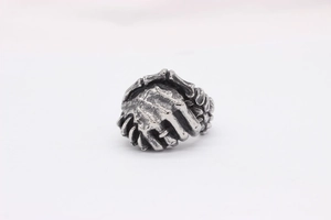 Detailed view of retro punk steel ring featuring a unique skeleton handshake design