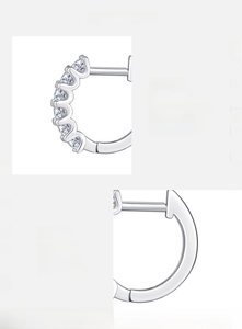 Detailed view of D color VVS1 moissanite stones set in 925 sterling silver earring studs