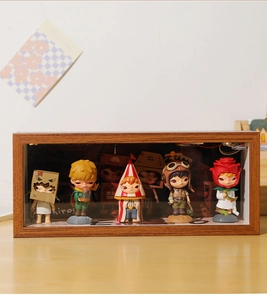 Detail of wooden display box with LED wiring and five collectible art toy figurines