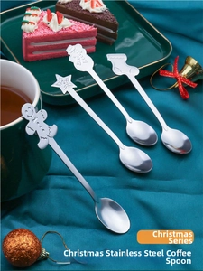 Close-up of stainless steel Christmas coffee spoons with cute gingerbread man and snowman designs