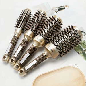 Set of four professional ceramic ionic round hair brushes with boar bristles in gold finish