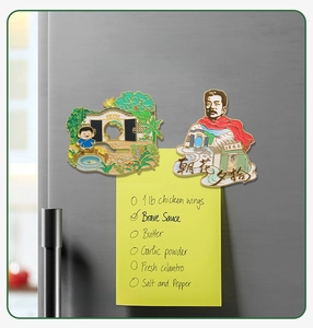 Detail view of magnetic Lu Xun souvenir stickers used as a note holder on fridge surface