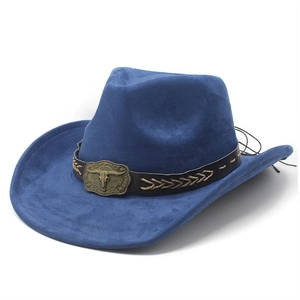 Detail of dark blue suede cowboy hat featuring vintage bull head buckle and braided leather band