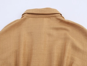 Detail of the back collar and shoulder on a khaki lace-spliced commuter shirt