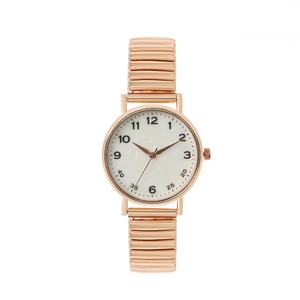 Montre rétro dorée à cadran rond avec bracelet extensible en métal pour femmes