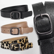 Detail view of stylish PU leather belts with bow decor and metal pin buckles