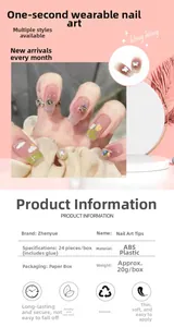 Close-up of pink gradient press-on nails with butterfly decor and floral patterns