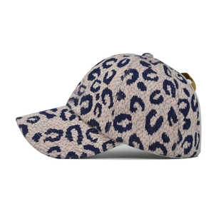 Detailed close-up of thickened knitted leopard baseball cap with adjustable rear strap