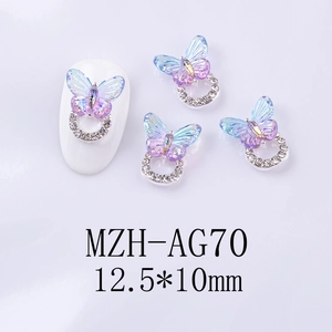 Detail of gradient butterfly nail charm with crystal ring and laser rainbow effect