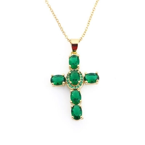 Detail of a gold cross pendant necklace featuring five oval green zircon stones and crystals
