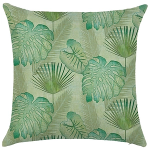 Detail of the high-quality linen texture and tropical palm leaf prints on the cushion cover