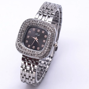 Elegant women's square quartz watch with rhinestones and silver metal strap on white background