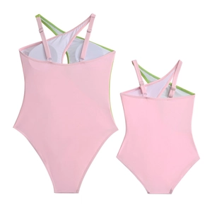 Pink and green one-piece family swimwear with cross straps and built-in bra pads