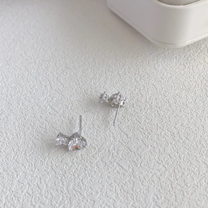 Macro shot of S925 sterling silver heart studs with sparkling 5A zircon inlay