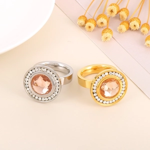 Detailed macro view of 18K gold and silver double-layered rings with champagne gemstones
