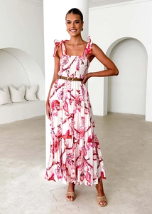 Detail of floral maxi dress featuring tie straps, shirred bodice and tiered ruffle hem