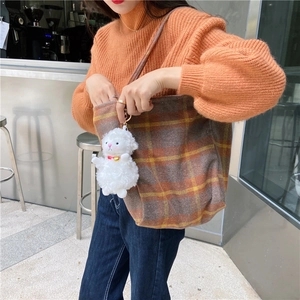 Large capacity checkered wool tote bag with cute white lamb plush keychain accessory.