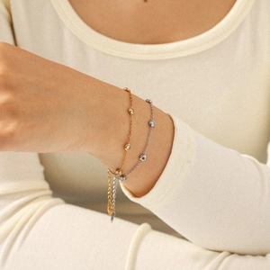Elegant gold and silver stainless steel tassel zircon necklaces worn by a model