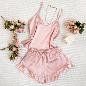 Elegant two-piece silk satin pajama set with V-neck camisole and ruffled shorts in pink