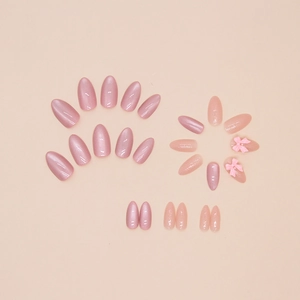 Set unghie finte rosa con fiocchi 3D e glitter perlati in forma a mandorla