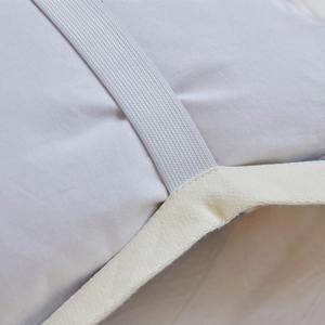 Four-layer cotton gauze pillow towel with elastic strap and light gray fabric detail
