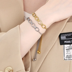 Detailed shot of adjustable gold and silver hexagonal link bracelets on a model wrist