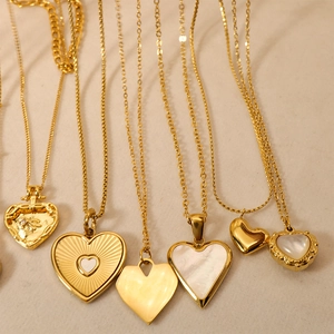 Golden heart necklaces in various designs with mother of pearl and engraved textures