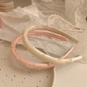 Elegant pink and beige satin headbands with pearl accents for a high crown hairstyle