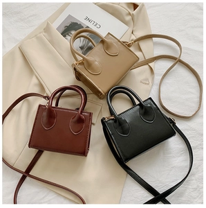 Detailed display of vintage mini square bags in khaki, reddish brown, and black leather texture