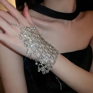 Elegant silver layered tassel hand chain bracelet with crystal fringe and ring connector