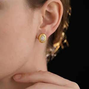 Elegant vintage oval stud earrings with large crystal and gold brushed metal finish