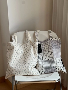 Detail of floral and patchwork tote bags in cotton fabric showing texture and patterns