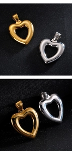 Detail view of gold and silver hollow heart pendants with high polished metallic finish