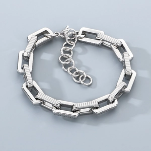 Detailed top view of a chunky silver industrial steel chain bracelet with lobster clasp