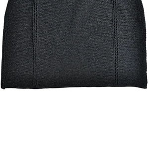 Close-up of black knitted fabric showing fine texture and vertical double stitching detail