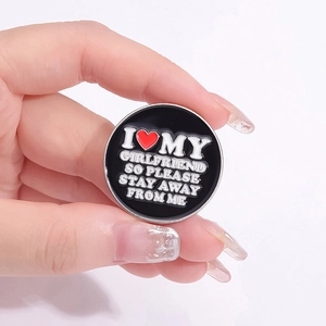 Classic enamel pin featuring I Love My Girlfriend text with a red heart on black background